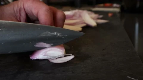 Chopping shallots with chefs knife Stock Footage 172052884