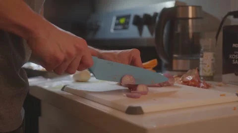 Chopping shallots on cutting board - Making Sweet Potato Risotto - Clip 19 Stock Footage 243082666