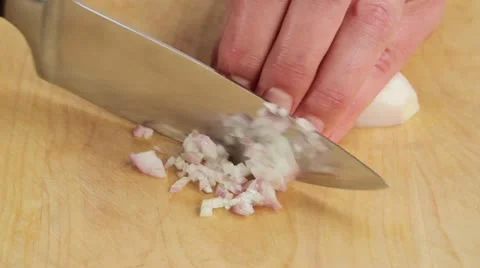 Chopping shallots finely Stock Footage 24667125