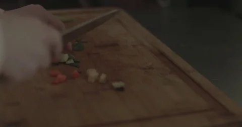 Chopping spices on a cutting board Stock Footage 76413306