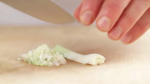 Chopping spring onions finely Stock-Footage 24662111