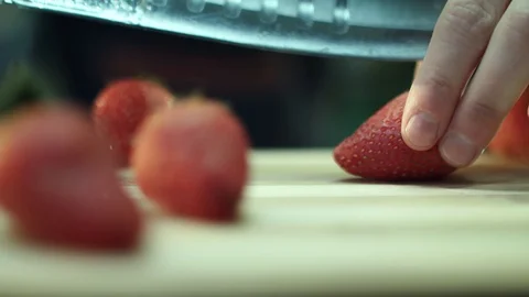 Chopping a strawberry Stock Footage 129087030