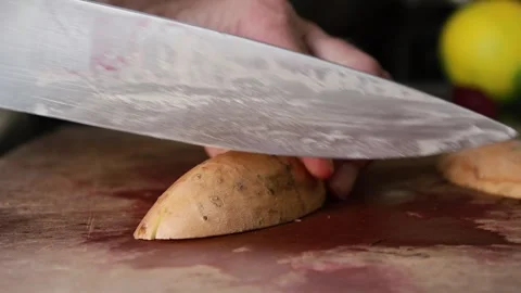 Chopping sweet potatoes 스톡 동영상 277467559