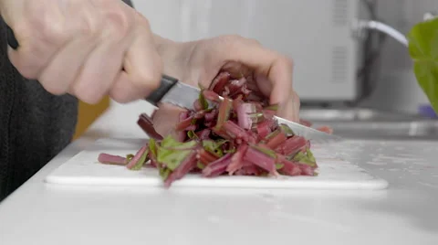 Chopping swiss chard. Preparing for cooking Vídeos de archivo 61811525