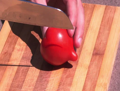 Chopping a tomato roughly Stock Footage 39908902