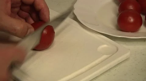 Chopping tomato on white plastic table. Stock Footage 11150178