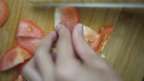 Chopping tomatoes for cooking kitchen ingredient Stock Footage 117130886