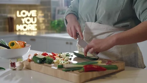 Chopping vegetables on a chopping board Stock Footage 254588668