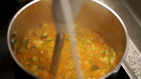 Chopping vegetables with a mixer Stock Footage 127848504