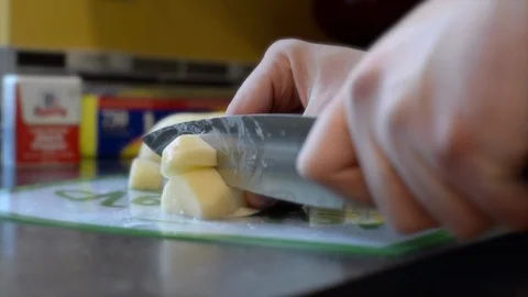 Chopping vegetables for a roast Stock Footage 101863847