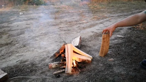 Chopping wood and making a fire in nature   Stock Footage 120465231
