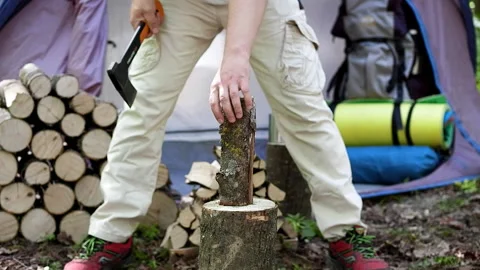 Chopping wood with an ax. Stock Footage 98487866