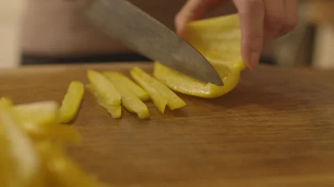 Chopping Yellow Peppers Stock Footage 260322474