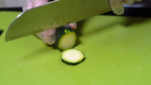 Chopping zucchini vegetable with a knife Stock-Footage 111330653