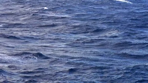 Choppy deep blue open ocean water with rolling waves and white foam Stock Footage 345941868