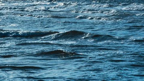 Choppy ocean water surface texture background with white foam waves Stock Photos