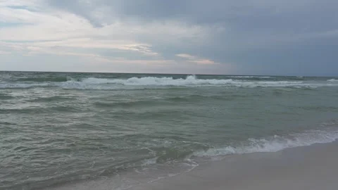 Choppy ocean waves and cloudy sky on a Florida beach, stormy weather Stock Footage 345689645