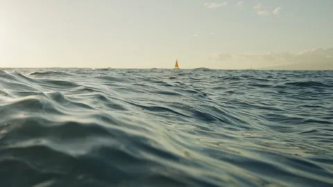 Choppy Waves at Sunset and Sail Boats in the Distance 4K Stock Footage 263282810