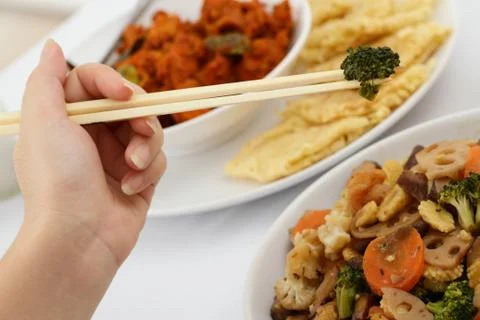 Chopstick and broccoli Stock Photos