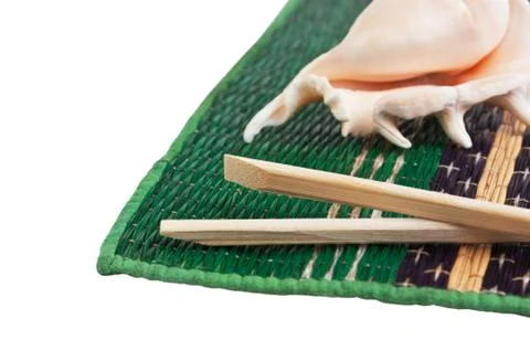 Chopsticks and shells Stock Photos