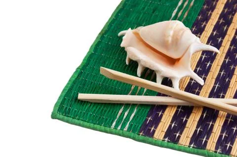 Chopsticks and shells Stock Photos