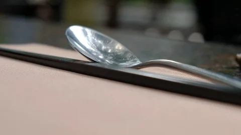 Chopsticks and spoon on the table in the wild restaurant 스톡 동영상 108672829