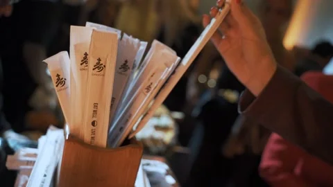 Chopsticks being picked up at event Stock Footage 138035540