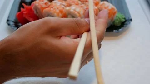 Chopsticks fall out of hand. Can't use chopsticks Stock Footage 137810331