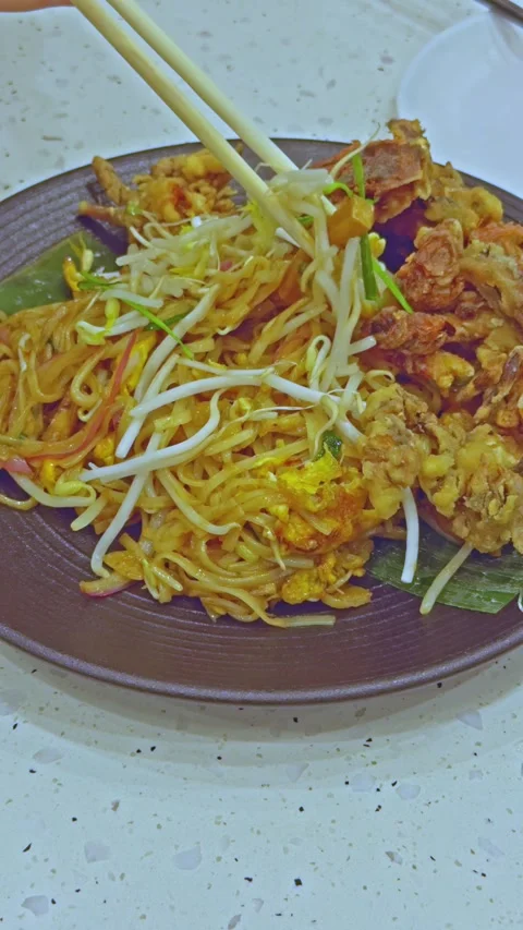Chopsticks Grabbing Soft Shell Crab Pad Thai Stock Footage 314985092