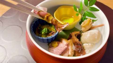 Chopsticks Picking Up Firefly Squid from Traditional Japanese Kaiseki Stock Footage 331768387