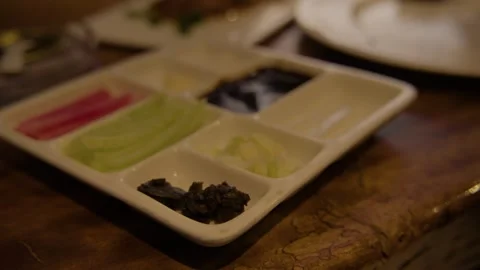 Chopsticks Selecting Condiments from Divided Plate in Beijing Restaurant Stock Footage 345762429