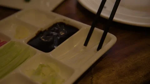 Chopsticks Selecting Sliced Vegetables from Condiment Tray in Beijing Restaurant Stock Footage 345762425