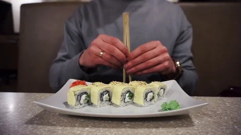 Chopsticks separating in restaurant Stock Footage 86317750