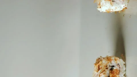 Chopsticks taking portion of sushi roll. Sushi rolls with salmon cream cheese Stock Footage 293918927