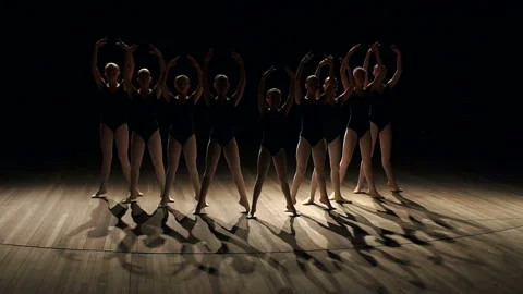 A choreographed dance of a group of graceful pretty young ballerinas on stage. Stock Footage 96593306