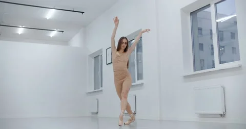 Choreographer dance on the ends of her pointe shoes and jumps, ballerina dances Stock Footage 148851856