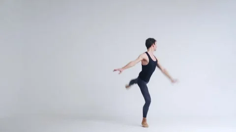Choreography, young ballet dancer performs acrobatic elements of a ballet dance Stock Footage 246477396