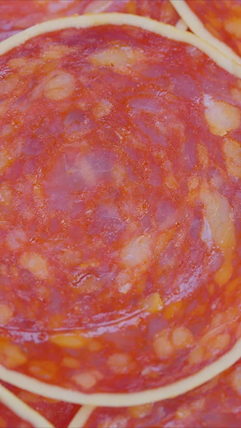 Chorizo slices pattern, Marbled spicy sausage closeup, Overlapping chorizo slice Stock Footage 325692391