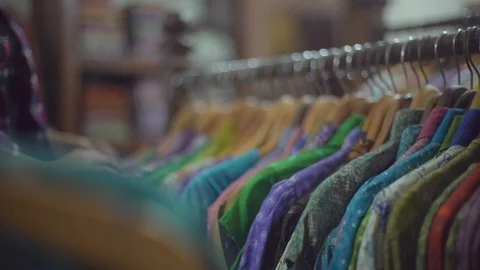 Chosing Batik on etalase Stock Footage 125803285