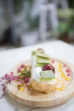 Choux cream with fruit Stock Photos