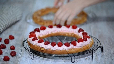 Choux pastry eclair cake Paris Brest with raspberry. Stock Footage 95636306