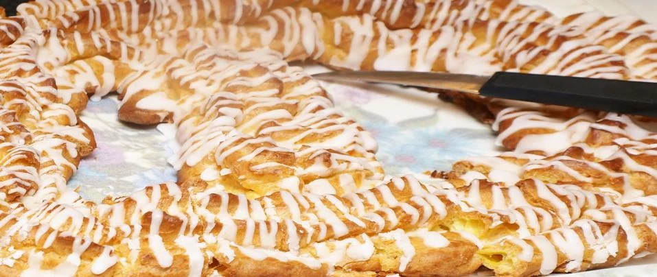 Choux pastry ring, with icing Stock Photos