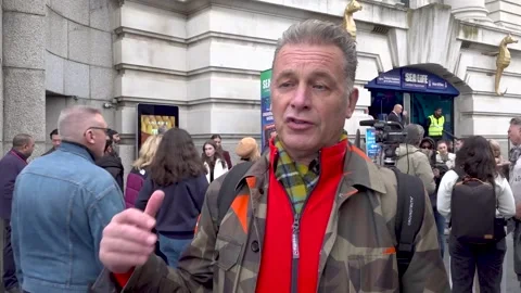 Chris Packham protests for the release of penguins from  Sea Life London Aquari Stock Footage 319430585