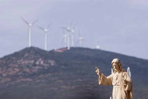 Christ blessing with windmills in the background Stock Photos