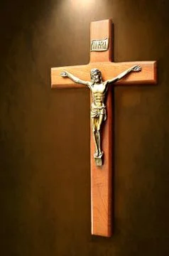 Christ on the cross with light shing down Stock Photos