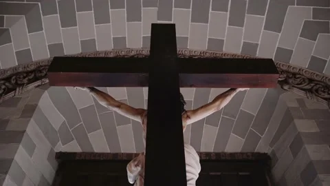 The Christ on a cross rear view in the  interior of a Mexican Catholic Cathedral Stock Footage 238943350