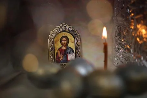 Christ Icon, blured easter eggs and candle in a Christian Orthodox church Stock Illustration