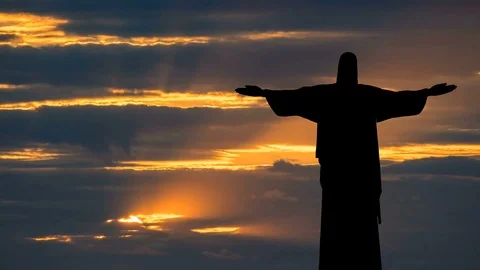 Christ The Redeemer Of Rio De Janeiro, Brazil Silhouette Golden Hour Clouds Stock Footage