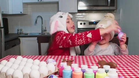 Christ is risen. Children play with Easter eggs, decorate and prepare for Easter Stock Footage 262757895