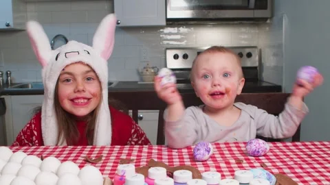 Christ is risen. Children play with Easter eggs, decorate and prepare for Easter Stock Footage 262757923